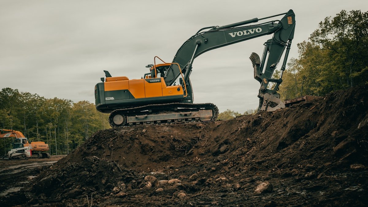 Excavator working on a bright construction site
